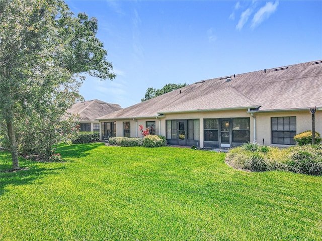 264 Juniper Way, Tavares, FL 32778 - back of property with a lawn and stucco siding