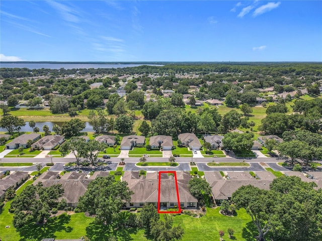 264 Juniper Way, Tavares, FL 32778 - aerial view of property and surrounding area featuring property boundaries highlighted, a nearby body of water, and nearby suburban area