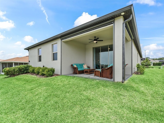 17108 SE 111th Terrace Rd, Summerfield, FL 34491 - rear view of property featuring a ceiling fan, an outdoor hangout area, a lawn, and stucco siding
