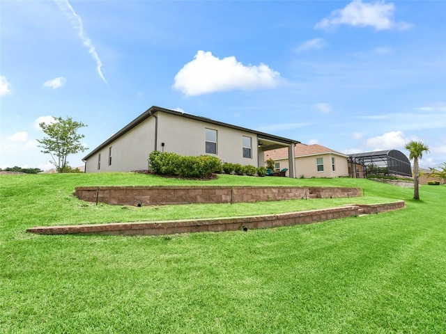 17108 SE 111th Terrace Rd, Summerfield, FL 34491 - view of home's exterior featuring stucco siding, a yard, and a carport
