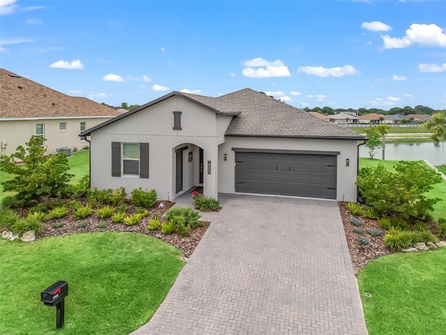 17108 SE 111th Terrace Rd, Summerfield, FL 34491 - ranch-style house with a garage, a front yard, stucco siding, and decorative driveway