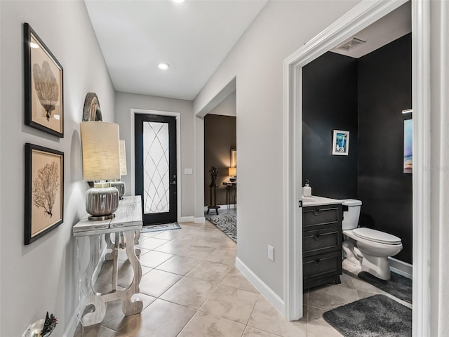 17108 SE 111th Terrace Rd, Summerfield, FL 34491 - entryway featuring light tile patterned floors, baseboards, and recessed lighting