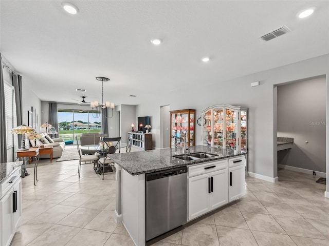 17108 SE 111th Terrace Rd, Summerfield, FL 34491 - kitchen with dishwasher, a sink, open floor plan, dark stone countertops, and recessed lighting
