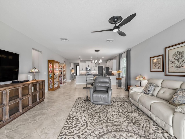 17108 SE 111th Terrace Rd, Summerfield, FL 34491 - living area featuring a ceiling fan, baseboards, and light tile patterned flooring