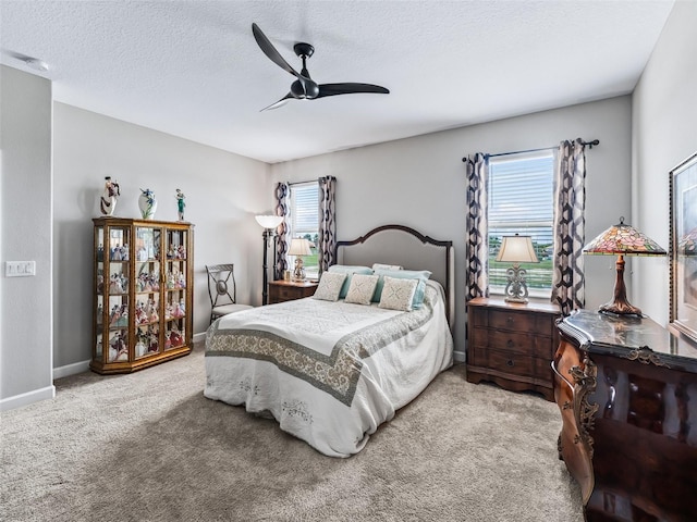 17108 SE 111th Terrace Rd, Summerfield, FL 34491 - bedroom featuring carpet floors, a ceiling fan, a textured ceiling, and baseboards