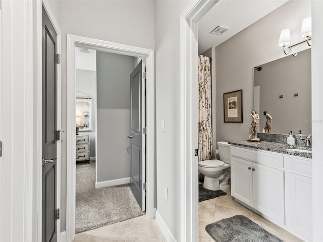 17108 SE 111th Terrace Rd, Summerfield, FL 34491 - full bathroom with toilet, vanity, tile patterned flooring, and baseboards