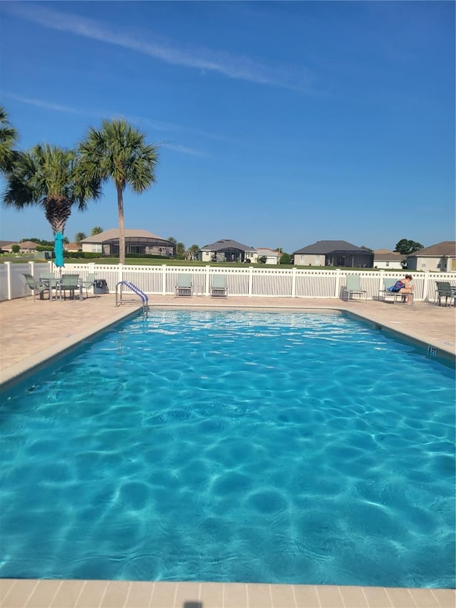 17108 SE 111th Terrace Rd, Summerfield, FL 34491 - community pool featuring a patio and a residential view