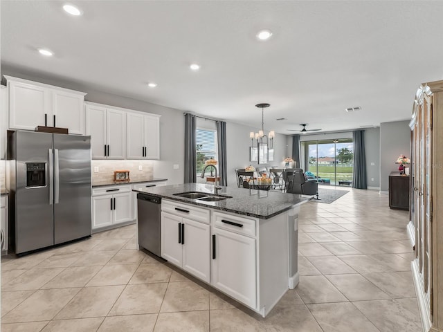 17108 SE 111th Terrace Rd, Summerfield, FL 34491 - kitchen with appliances with stainless steel finishes, a sink, light tile patterned floors, recessed lighting, and decorative backsplash