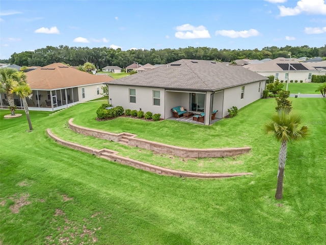 17108 SE 111th Terrace Rd, Summerfield, FL 34491 - back of house with a lawn, a patio, a shingled roof, a residential view, and stucco siding