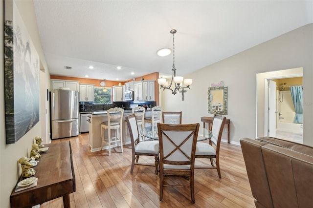 8039 SE 174th Belhaven Loop, The Villages, FL 32162 - dining space with a chandelier, light wood finished floors, and recessed lighting