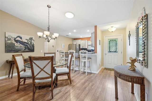 8039 SE 174th Belhaven Loop, The Villages, FL 32162 - dining area featuring light wood-type flooring, a chandelier, baseboards, and recessed lighting