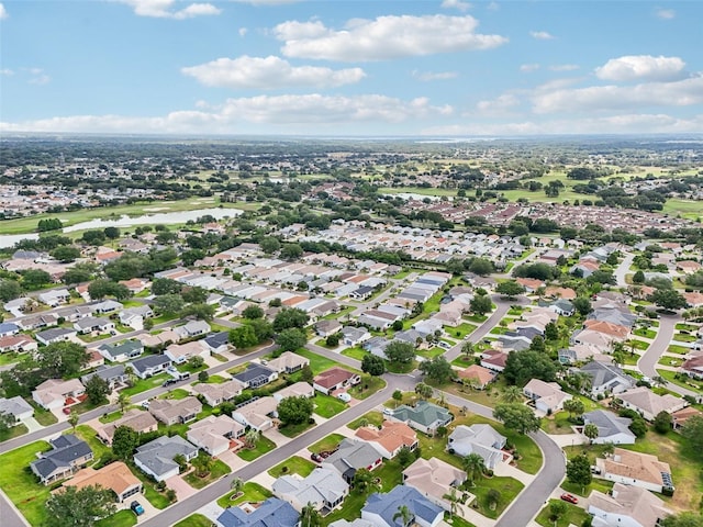 8039 SE 174th Belhaven Loop, The Villages, FL 32162 - aerial view of property's location with a large body of water and nearby suburban area
