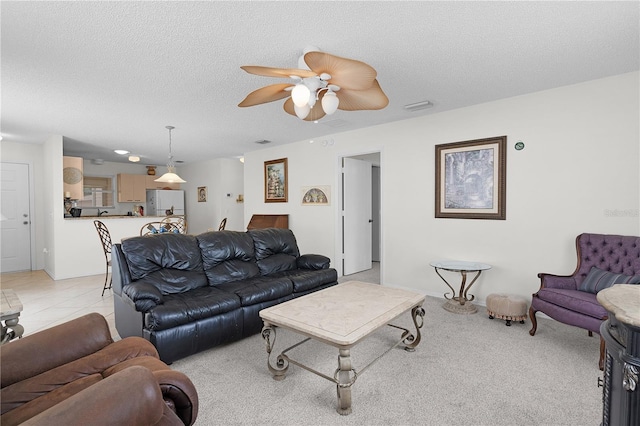 9321 SE 172nd Augusta Ln, The Villages, FL 32162 - living area with ceiling fan and a textured ceiling