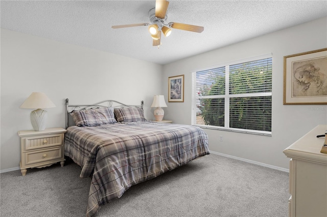 9321 SE 172nd Augusta Ln, The Villages, FL 32162 - bedroom with carpet flooring, baseboards, a textured ceiling, and ceiling fan