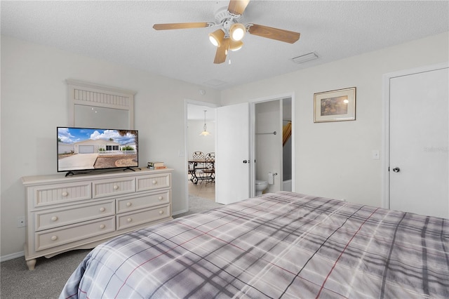 9321 SE 172nd Augusta Ln, The Villages, FL 32162 - bedroom with dark carpet, a textured ceiling, a ceiling fan, and baseboards