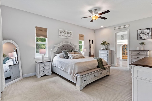 9512 Mid Summer Ln, Leesburg, FL 34788 - bedroom featuring multiple windows, light colored carpet, baseboards, and recessed lighting