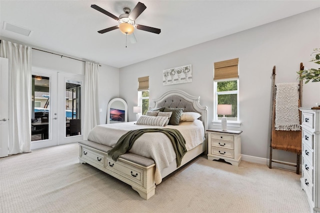 9512 Mid Summer Ln, Leesburg, FL 34788 - bedroom with access to outside, light colored carpet, baseboards, and ceiling fan