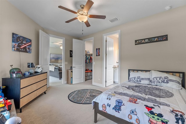 9512 Mid Summer Ln, Leesburg, FL 34788 - bedroom featuring light carpet, a spacious closet, a ceiling fan, baseboards, and connected bathroom