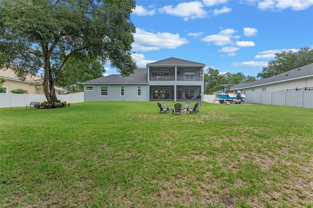 9512 Mid Summer Ln, Leesburg, FL 34788 - back of house featuring a sunroom and a fire pit