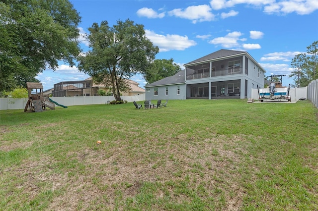 9512 Mid Summer Ln, Leesburg, FL 34788 - back of property with a sunroom and a playground