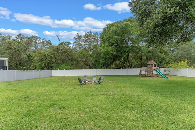 9512 Mid Summer Ln, Leesburg, FL 34788 - view of yard featuring an outdoor fire pit and a playground