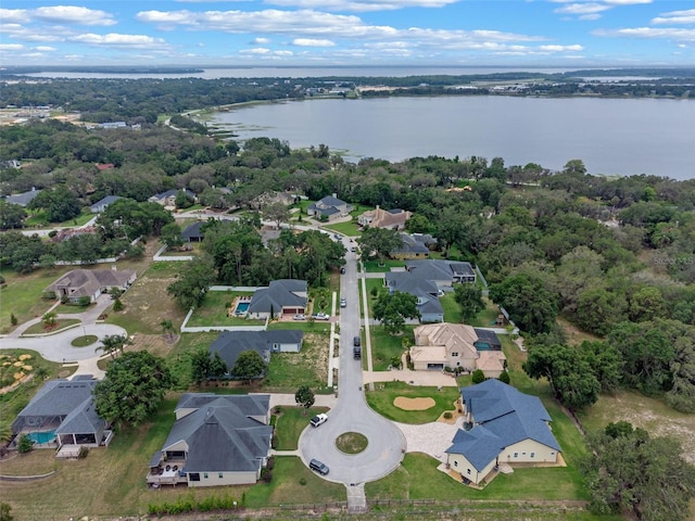 9512 Mid Summer Ln, Leesburg, FL 34788 - aerial view of property's location featuring a large body of water and nearby suburban area