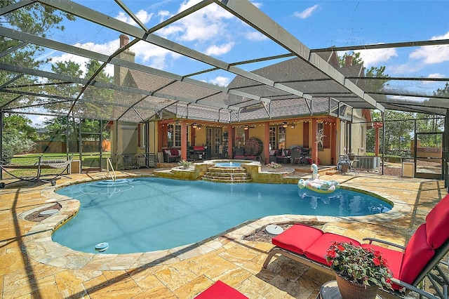 707 S Dixie Dr, Howey In The Hills, FL 34737 - view of pool with a patio area, a pool with connected hot tub, and glass enclosure