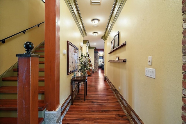 707 S Dixie Dr, Howey In The Hills, FL 34737 - hallway featuring stairway, crown molding, dark wood-type flooring, and baseboards