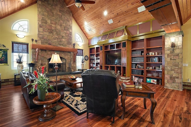 707 S Dixie Dr, Howey In The Hills, FL 34737 - living area featuring high vaulted ceiling, wooden ceiling, a ceiling fan, hardwood / wood-style floors, and a stone fireplace
