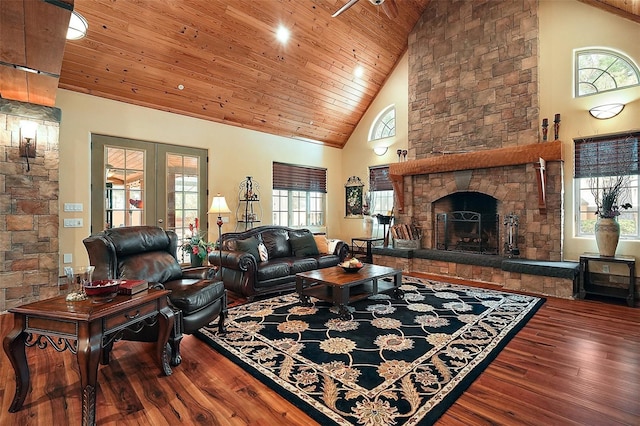 707 S Dixie Dr, Howey In The Hills, FL 34737 - living area with hardwood / wood-style flooring, high vaulted ceiling, wood ceiling, a fireplace, and french doors