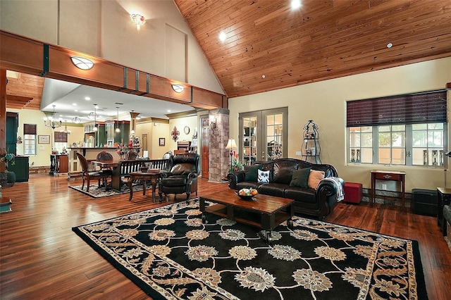 707 S Dixie Dr, Howey In The Hills, FL 34737 - living room featuring wooden ceiling, high vaulted ceiling, wood-type flooring, and a chandelier