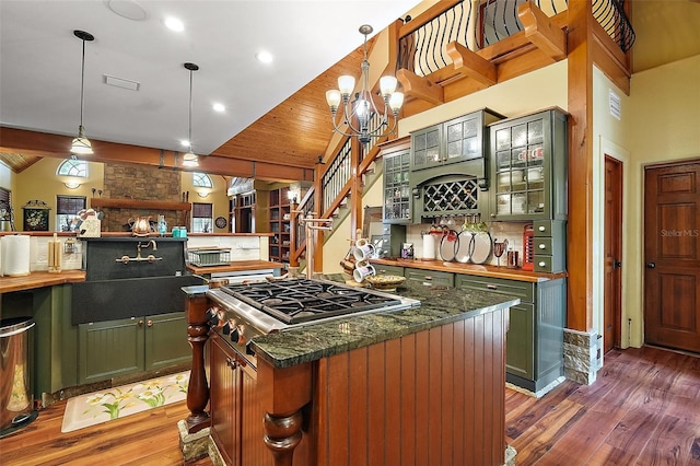707 S Dixie Dr, Howey In The Hills, FL 34737 - kitchen with green cabinets, wood finished floors, butcher block counters, stainless steel gas stovetop, and wooden ceiling