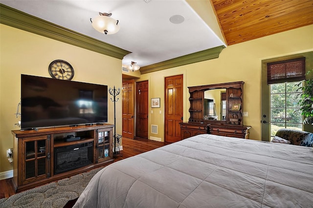 707 S Dixie Dr, Howey In The Hills, FL 34737 - bedroom featuring wood finished floors, baseboards, access to exterior, and ornamental molding