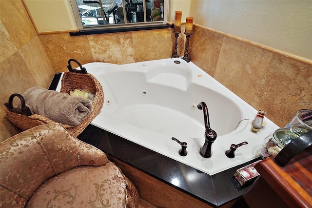 707 S Dixie Dr, Howey In The Hills, FL 34737 - full bath with tile walls and a tub with jets