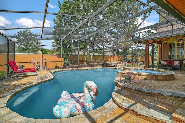 707 S Dixie Dr, Howey In The Hills, FL 34737 - view of pool with an in-ground hot tub, a patio area, a fenced backyard, and glass enclosure