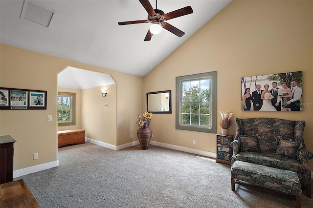 707 S Dixie Dr, Howey In The Hills, FL 34737 - living area with carpet floors, a ceiling fan, high vaulted ceiling, baseboards, and arched walkways
