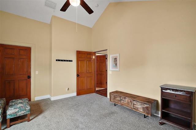 707 S Dixie Dr, Howey In The Hills, FL 34737 - carpeted bedroom featuring high vaulted ceiling, baseboards, and ceiling fan