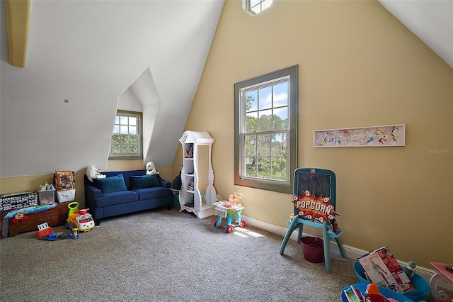 707 S Dixie Dr, Howey In The Hills, FL 34737 - playroom featuring lofted ceiling, carpet floors, and baseboards