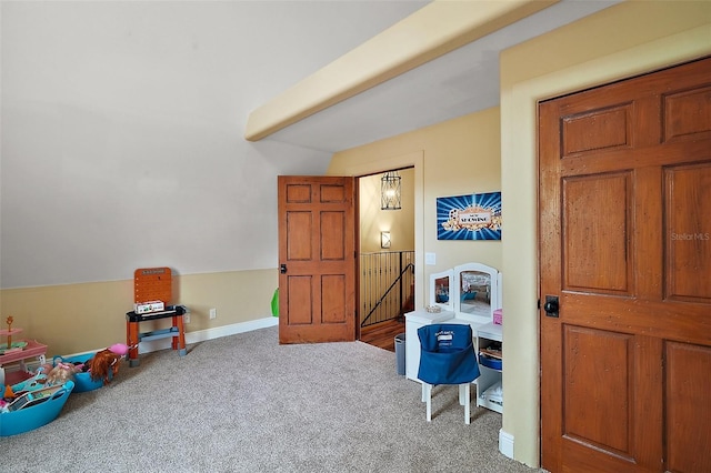 707 S Dixie Dr, Howey In The Hills, FL 34737 - rec room with lofted ceiling, carpet flooring, and baseboards
