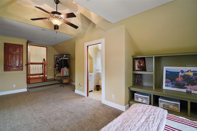 707 S Dixie Dr, Howey In The Hills, FL 34737 - bedroom with vaulted ceiling, carpet floors, and baseboards
