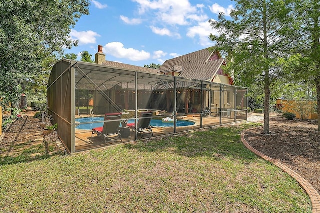 707 S Dixie Dr, Howey In The Hills, FL 34737 - back of house featuring an outdoor pool, a chimney, a yard, and a lanai