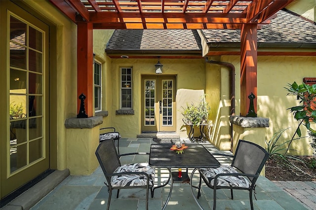 707 S Dixie Dr, Howey In The Hills, FL 34737 - view of patio with a pergola, outdoor dining space, and french doors