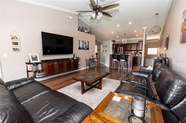 5437 Compass Pt Unit 00, Oxford, FL 34484 - living room featuring a ceiling fan, crown molding, dark wood-type flooring, lofted ceiling, and baseboards