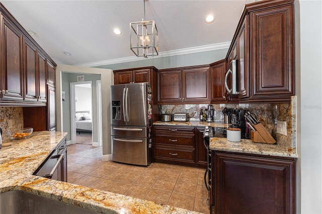 5437 Compass Pt Unit 00, Oxford, FL 34484 - kitchen featuring appliances with stainless steel finishes, light tile patterned floors, tasteful backsplash, dark brown cabinets, and recessed lighting