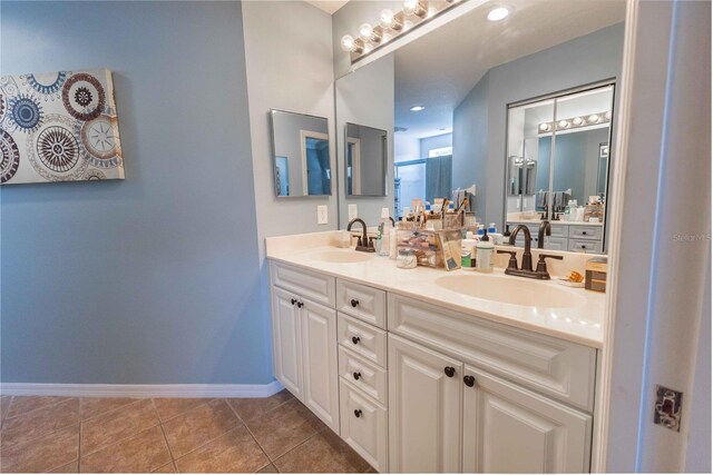 5437 Compass Pt Unit 00, Oxford, FL 34484 - bathroom with double vanity, baseboards, and tile patterned flooring