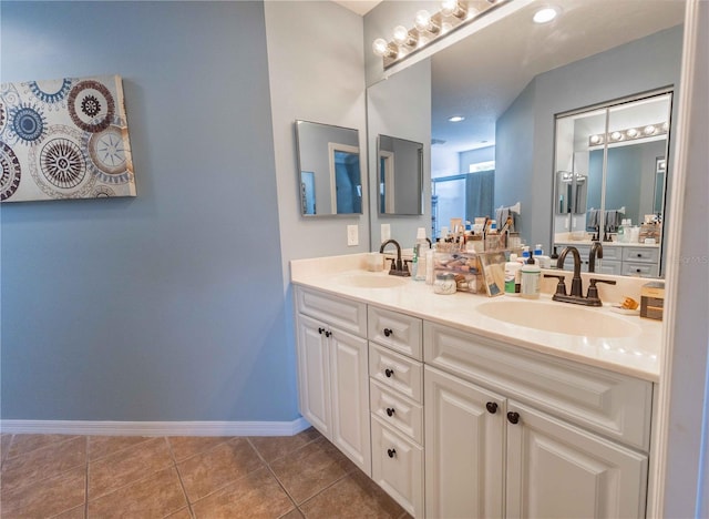5437 Compass Pt Unit 00, Oxford, FL 34484 - full bathroom with double vanity, baseboards, and tile patterned floors