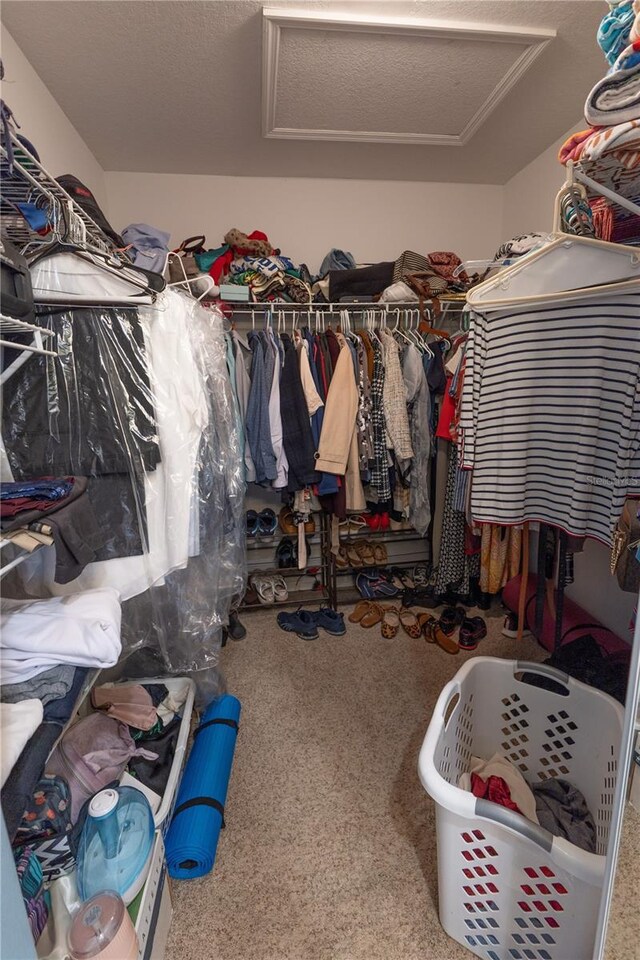5437 Compass Pt Unit 00, Oxford, FL 34484 - spacious closet featuring attic access