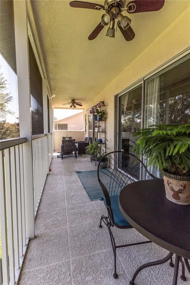 5437 Compass Pt Unit 00, Oxford, FL 34484 - view of patio / terrace with ceiling fan and a balcony