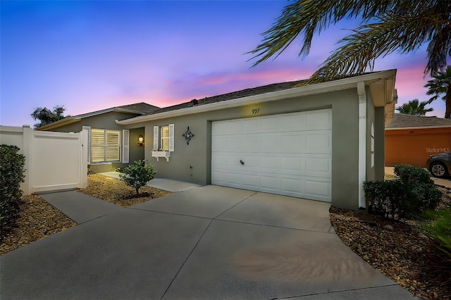 997 Oscar Ln, The Villages, FL 32162 - ranch-style home featuring stucco siding, driveway, and an attached garage