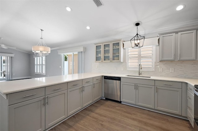 997 Oscar Ln, The Villages, FL 32162 - kitchen with dishwasher, a chandelier, a sink, gray cabinetry, and crown molding